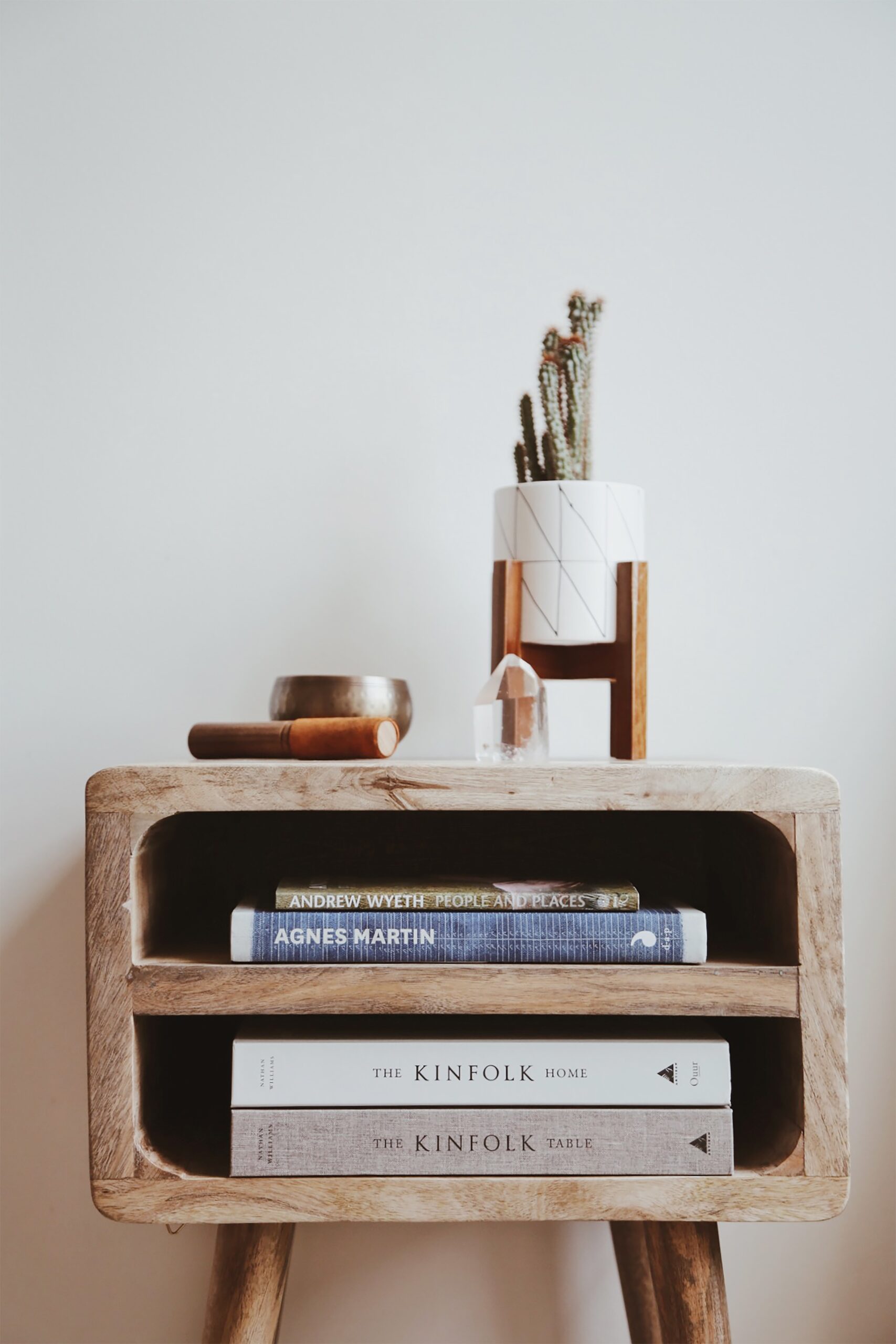 side table with books and plant